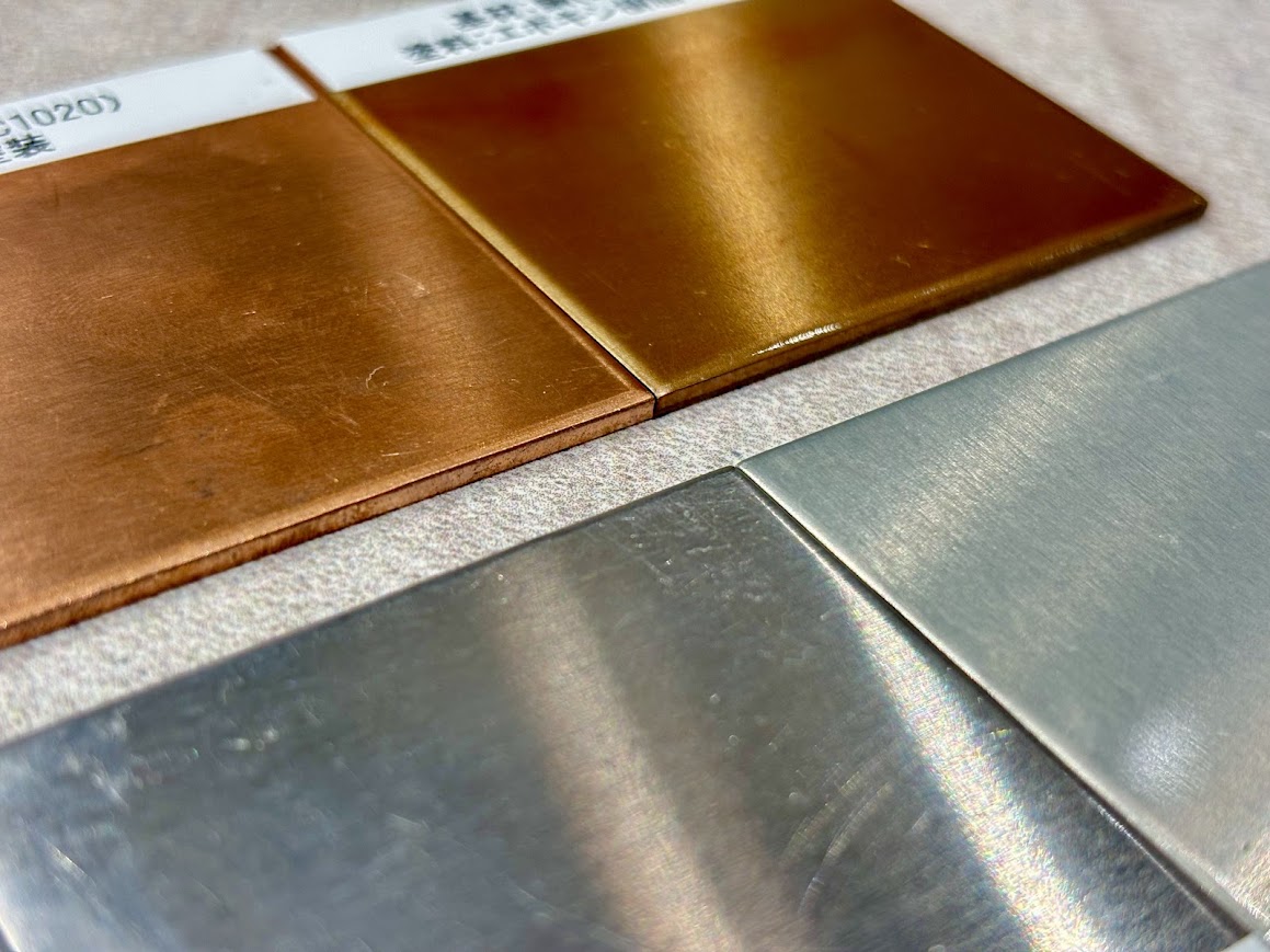 Example of painted products with electrodeposition paint. Coating on copper and aluminum plates.
